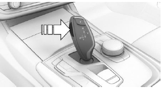 3. Push the selector lever in the desired direction,